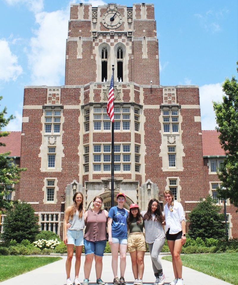 Scholars standing in front of Ayres Hall 